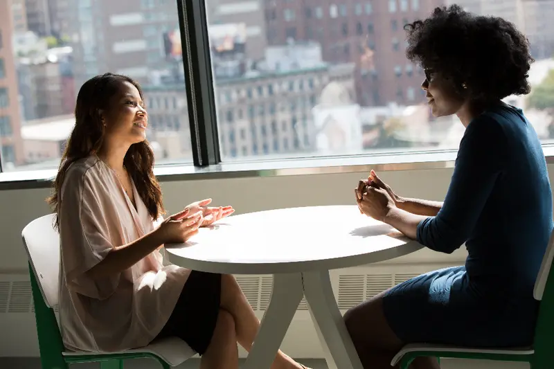 A counsellor talking with a student