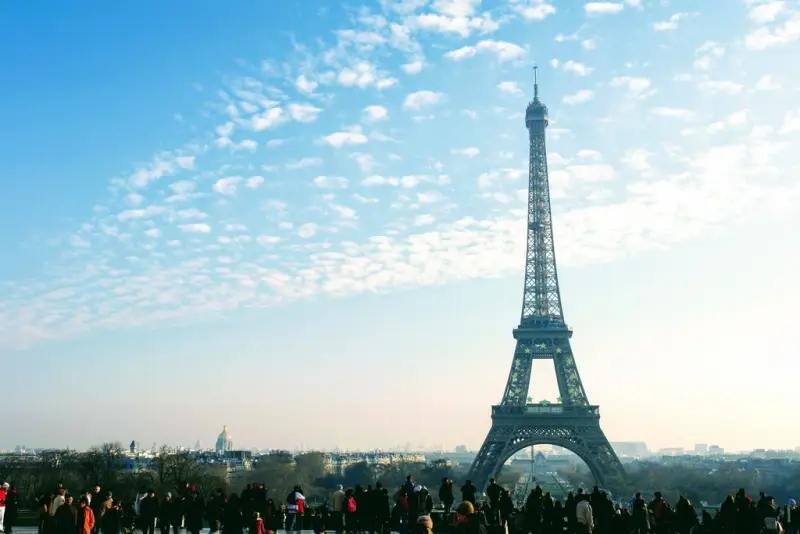 The Eiffel Tower against a blue sky